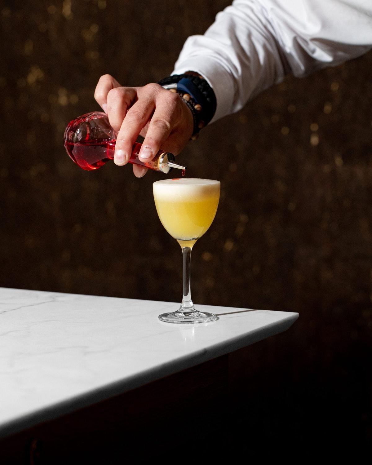 Middle Eight - Covent Garden - Preferred Hotels And Resorts London Ngoại thất bức ảnh A bartender topping a cocktail with a dash of Angostura Aromatic Bitters